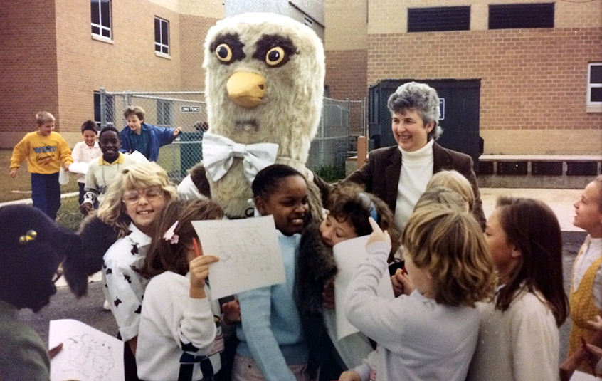 Photograph of Silverbrook students gathered around a person wearing the Seahawk mascot costume.