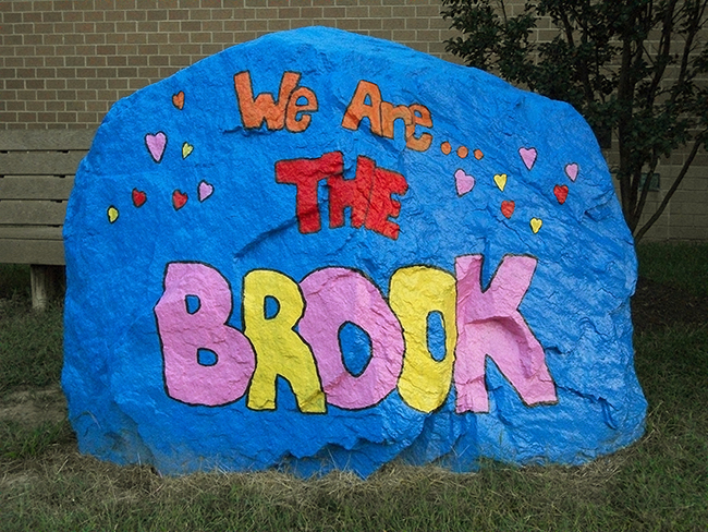Photograph of the large boulder that was installed in front of Silverbrook to serve as the school's spirit rock.